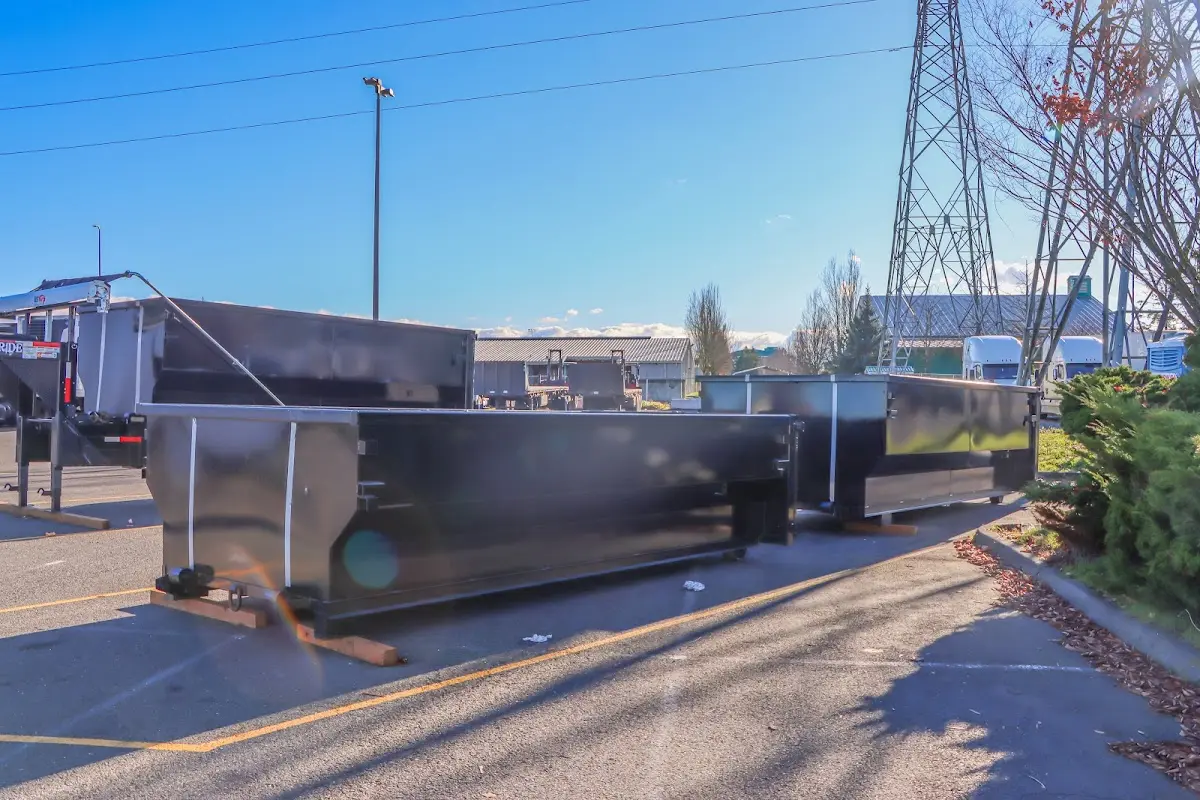 Roll-off dumpster ready for waste disposal at job site for 3 Yard Dumpster Rental in Reynolds